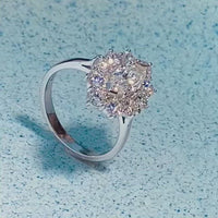 Marquise diamond ring sparkling on textured background, ELTONS Mayfair.