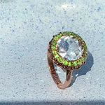 An Aquamarine Demantoid Garnet Ring