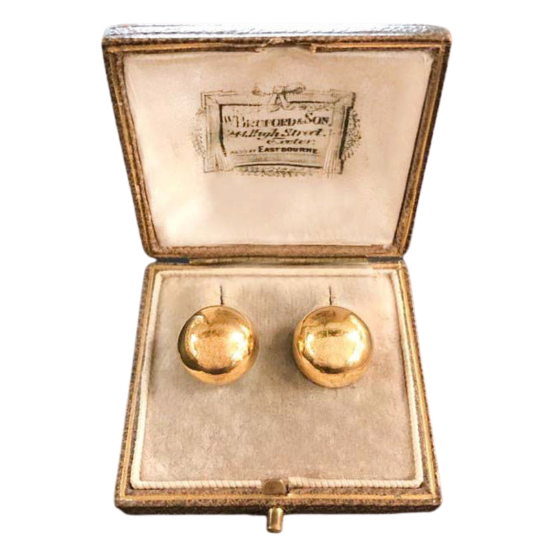 A Pair of Half Ball Gold Earrings
