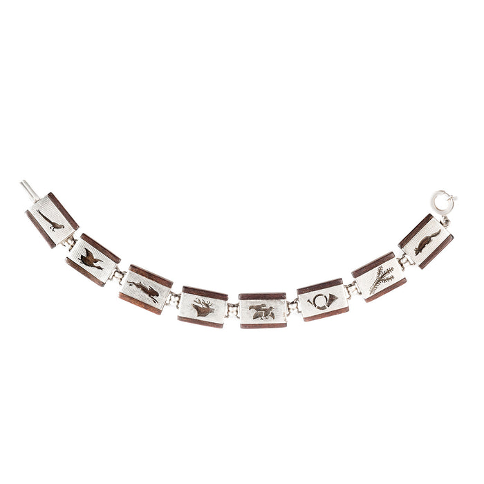 Mid-century silver and wood bracelet with engraved alpine hunting motifs, c.1950s