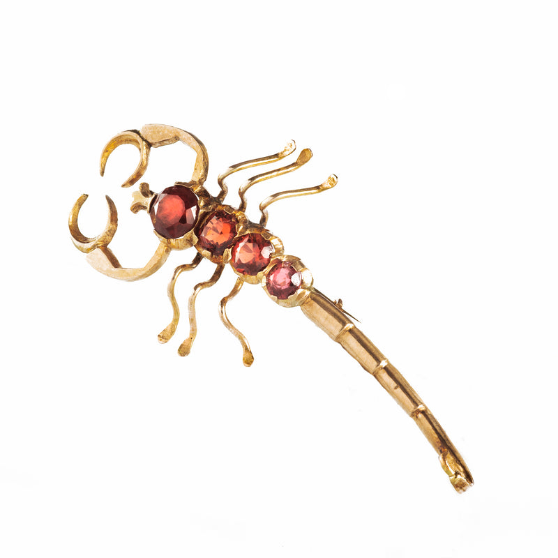 A Gold and Garnet Scorpion Brooch