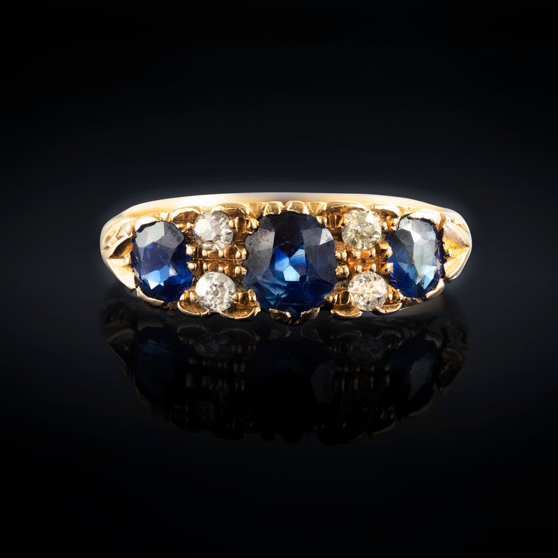 A three Sapphire Diamond Ring