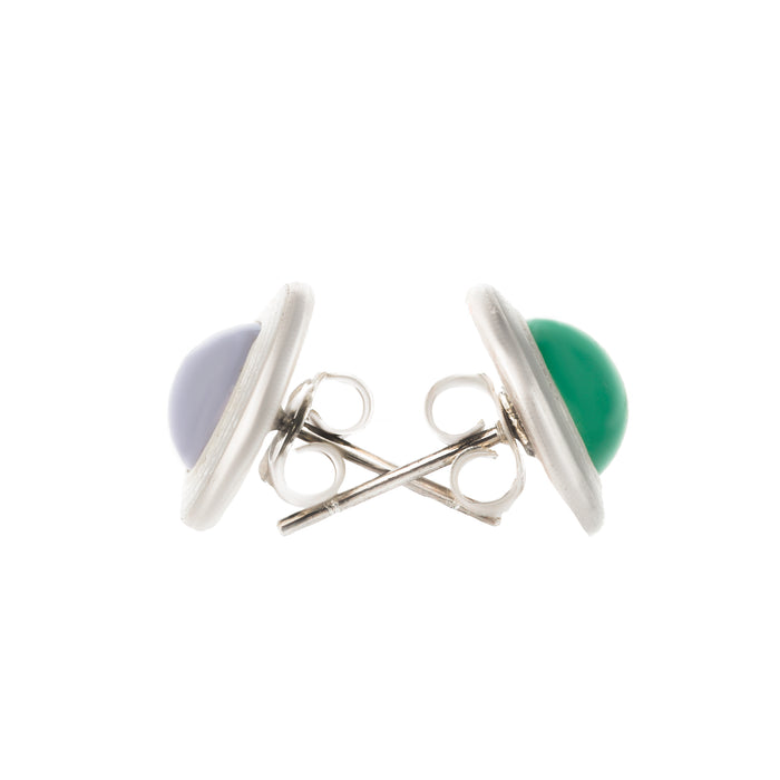 Side view of mismatched silver stud earrings with new posts, featuring green and lilac tones