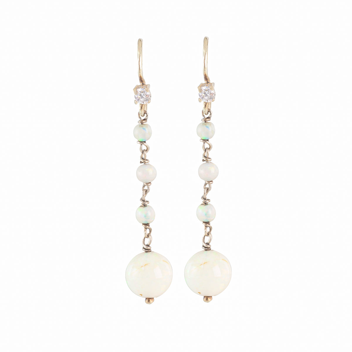Elegant 1930s drop earrings featuring luminous opals and diamonds set in 15ct gold, British-made, with a romantic and timeless design.”