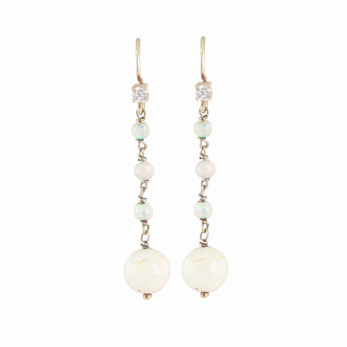 Elegant 1930s drop earrings featuring luminous opals and diamonds set in 15ct gold, British-made, with a romantic and timeless design.”