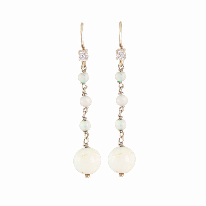 Elegant 1930s drop earrings featuring luminous opals and diamonds set in 15ct gold, British-made, with a romantic and timeless design.”