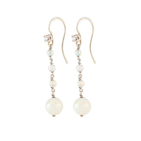 Side view of 1930s opal and diamond drop earrings, showcasing the elegant design and the fine setting in 15ct gold.