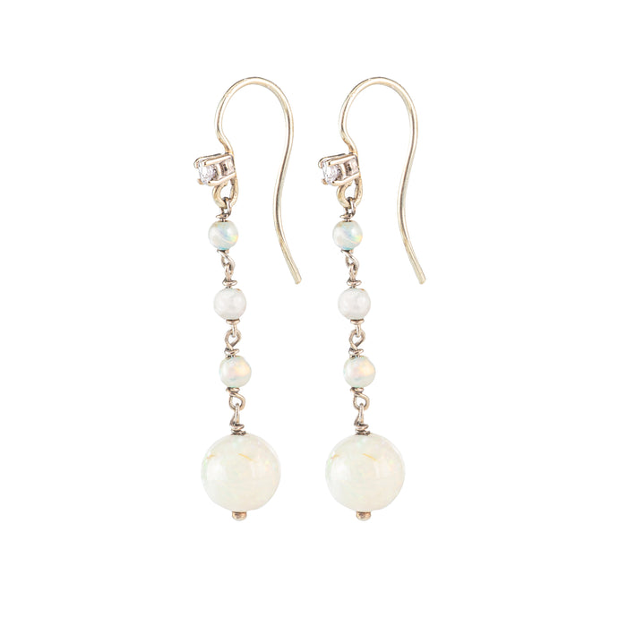 Side view of 1930s opal and diamond drop earrings, showcasing the elegant design and the fine setting in 15ct gold.