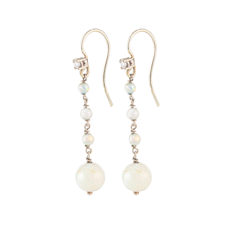 Side view of 1930s opal and diamond drop earrings, showcasing the elegant design and the fine setting in 15ct gold.
