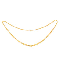 1960s 18ct gold bead necklace laid flat, showing polished spherical beads and warm golden tone.
