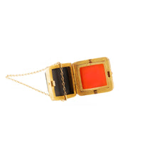 Antique gold fob pendant opened to reveal hidden compartment, Victorian era
