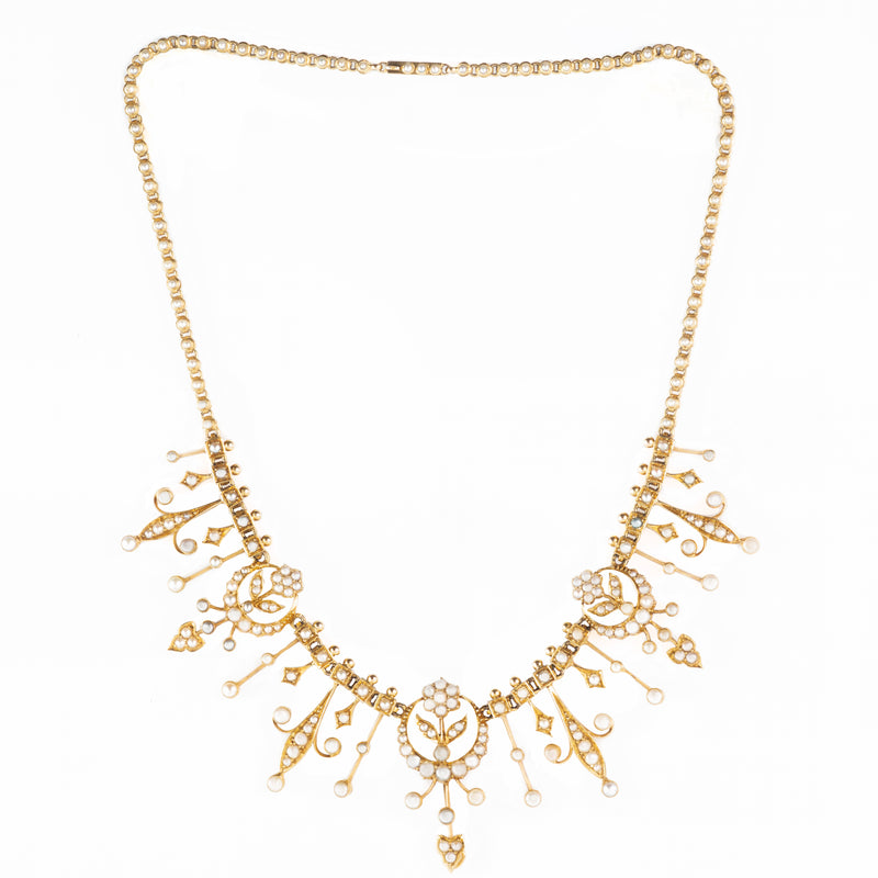 An Edwardian Gold Pearl Necklace