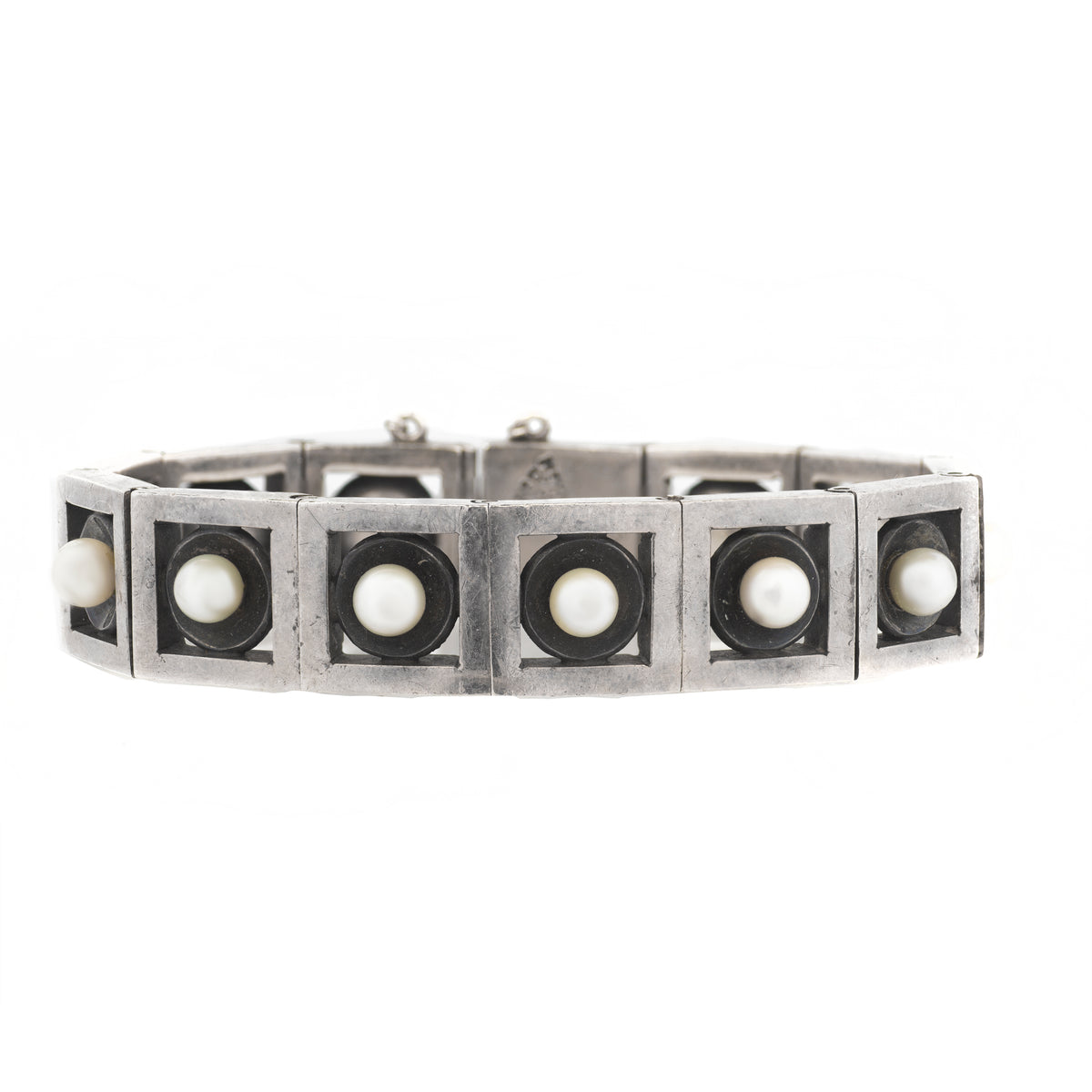 Close-up of Mexican silver bracelet with pearls, marked Antonio crown hallmark
