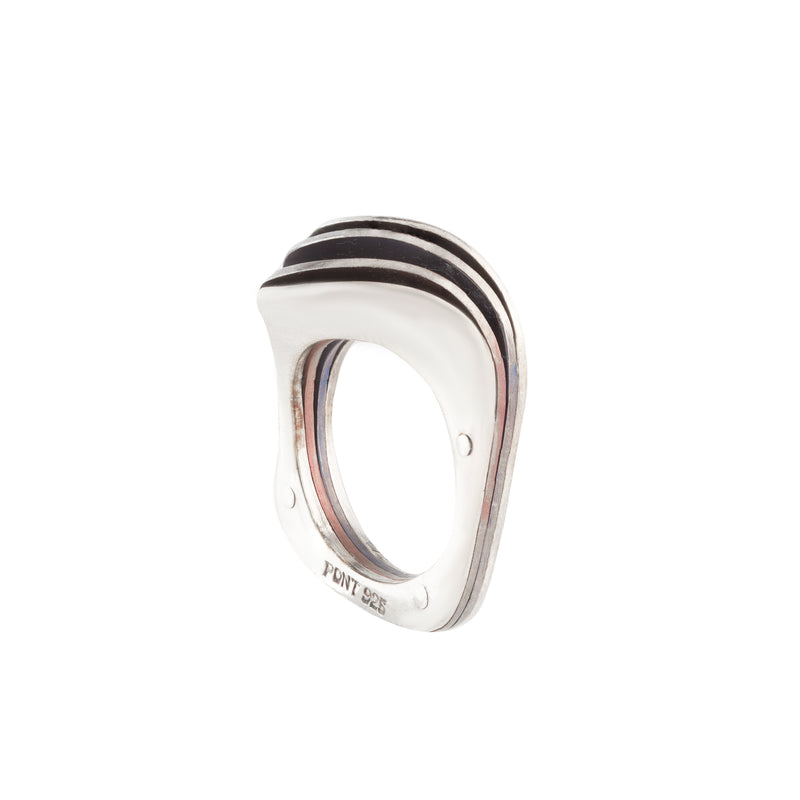 Side profile of a vintage silver modernist ring showing abstract curves and enamel inlay between silver bands