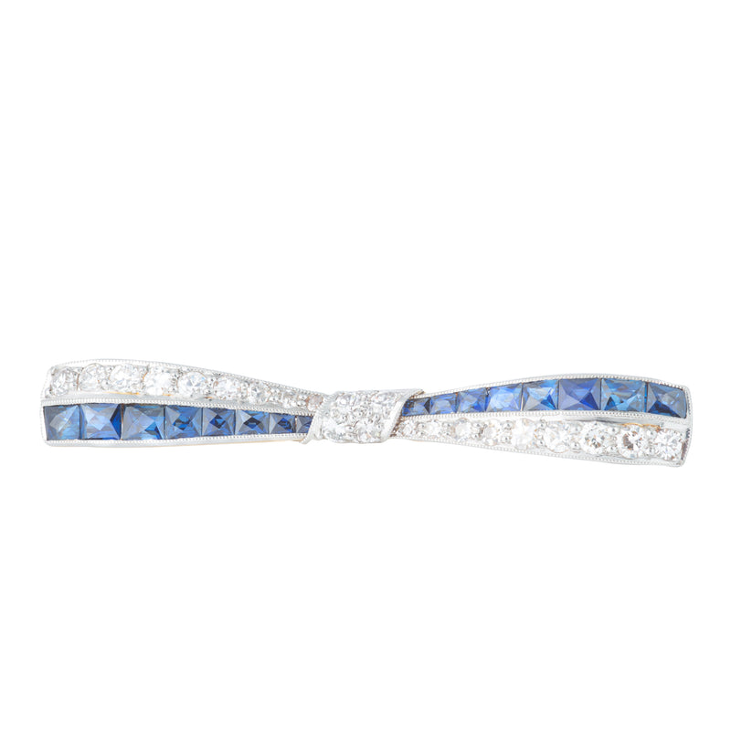 An Art Deco Diamond Sapphire Bow Brooch