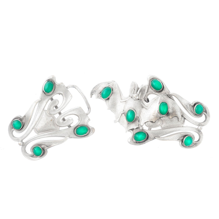 Antique silver buckle with stylised bat design and green chrysoprase stones, decorative Art Nouveau detailing.