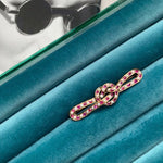 A Ruby Pearl Love Knot brooch