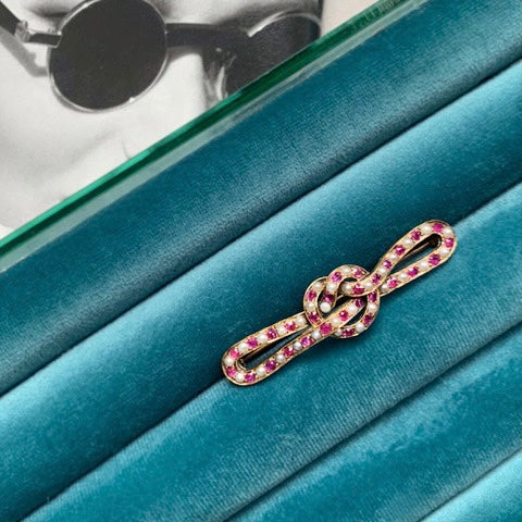 A Ruby Pearl Love Knot brooch